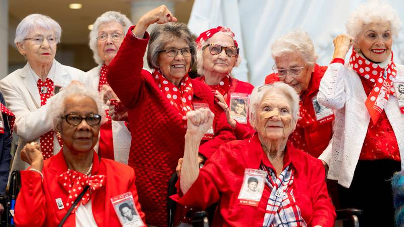 WASHINGTON, DC - APRIL 10: "Rosies" pose for a photo in front of the Statue of Freedome in Emancipation Hall before a Congressional Gold Medal Ceremony for the "Rosie the Riveter" women at the U.S. Capitol on April 10, 2024 in Washington, DC. Over two dozen women traveled to Washington DC from across the country to receive the gold medal for their wartime efforts in which they took jobs in factories and shipyards during World War II to help the war efforts. (Photo by Anna Moneymaker/Getty Images)