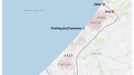 Israel says Hamas attacks a crossing point into Gaza, wounding 10 Israelis and forcing its closure