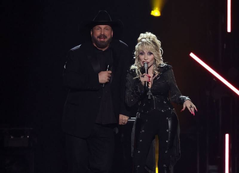 FRISCO, TEXAS - MAY 11: (L-R) Co-hosts Garth Brooks and Dolly Parton speak onstage during the 58th Academy Of Country Music Awards at The Ford Center at The Star on May 11, 2023 in Frisco, Texas. (Photo by Theo Wargo/Getty Images)