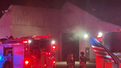 Tulsa firefighters contain a fire at a warehouse in west Tulsa